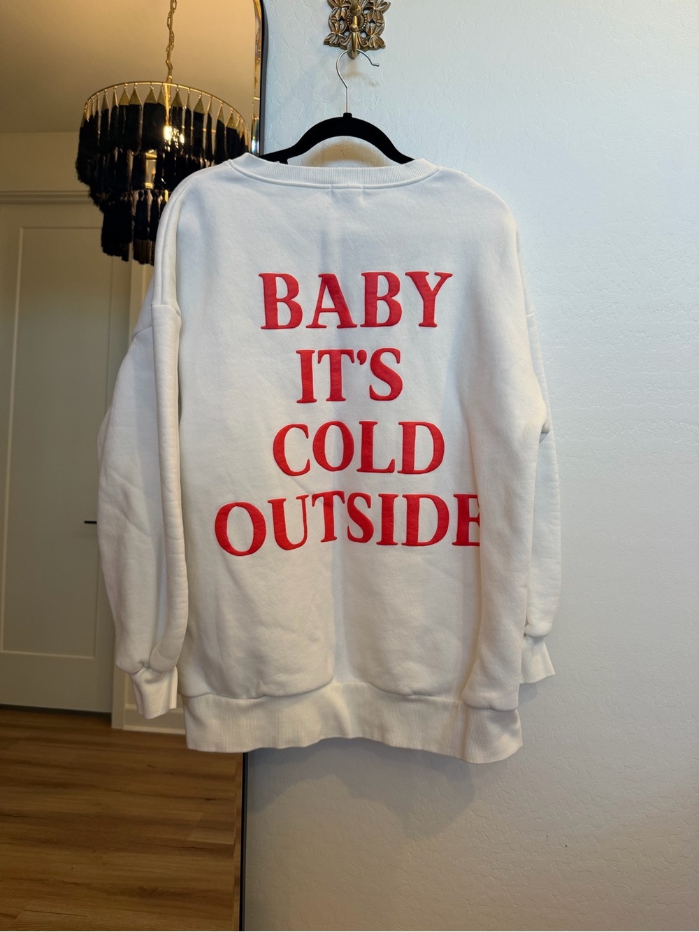 White Crewneck Sweatshirt with Red 'Baby It's Cold Outside' Graphic